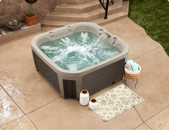 spa-with-a-basket-full-of-towels-next-to-it